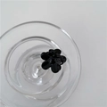 Mini black flower hair claw clip with glossy finish in a minimalist sweet style - Black Small Flower