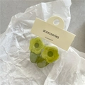 Pair of translucent green flower hair clips on a textured white paper background - Green