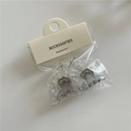 Mini transparent jelly hair clips in cream bow shape on retail card packaging - Crescent Gray and Transparent