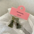 Cute dark green acetate bow hair clips for girls set on white paper background - Green Bow