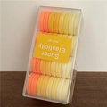 Set di elastici per capelli sfumati arancione e crema in scatola trasparente - Gamma gialla