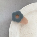 Cute flocked flower hair clip in dark gray and orange finish on ceramic background - Grey Flower Khaki Clip