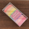 Dettaglio di 48 elastici per capelli macaron colorati in scatola trasparente - Colori Crema Chiaro
