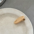Detailed close-up of handmade oval acetate hair clip in beige with gold metal alligator clip - Orange & Yellow
