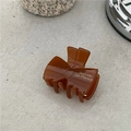 Elegant amber brown acetate bow hair clip with gold lettering for a French style look - Bow Claw Clip / Brown