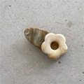 Close-up of a floral acetate hair clip with marble brown base and beige petal detail - White Flower Coffee Clip