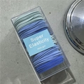 Set of colorful high-elasticity hair ties neatly organized in a transparent gift box - Blue