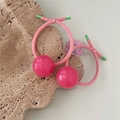 Detail of pink jelly ball hair ties with elastic cords on a textured stone plate - Rose Red Ball / Rose Red