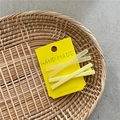Détail de l'ensemble de barrettes jaunes avec textures mates et givrées sur carte - X Paire de Pinces / Jaune