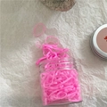 Close-up of pink elastic hair bands inside a transparent cylindrical storage jar - 180 Pieces/Pack / Rose Pink