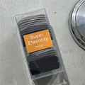 10-piece grey and black elastic hair tie set in a transparent storage box - Black-Grey Tones