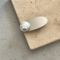 Silver hair clip with large round white pearl on a matte gold oval metal plate - Round Pearl Style