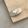 Silver hair clip featuring a high-gloss heart-shaped faux Mabe pearl and metal base - Heart Pearl Style