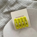 Detail of four matte yellow oval BB hair clips on a white accessories card for girls - H6.2 Yellow (four Round-headed Bb Clips) J181-b7