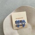 Close-up of two sky blue star-shaped metal hair clips on a minimalist beige card - A3.2 Dark Gray-blue (star Clip) Jx-b187