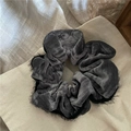Close-up of velvet scrunchie in dark gray with eyelash lace trim and soft texture - Gray
