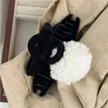 Detail of a black velvet bow hair claw clip featuring a large white faux fur pompom - White Ball Hair Claw (G7.5 -E)