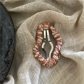 Detail of vintage BB clip with pink and brown woven yarn on beige linen background - Cloud Knitted Style (J28-B7) / Orange Pink