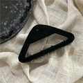 Close-up of a matte black flocked triangular hair claw clip on a minimalist textured background - Black Triangle