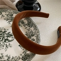 Detailed macro view of the brown velvet padded headband featuring a handmade inner label - Brown Coffee