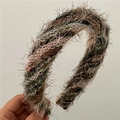 Close-up of a wide padded headband featuring colorful knitted plush fuzzy yarn fabric - Headband / Green Gradient