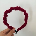 Detailed view of burgundy velvet pleated headband with protective black ribbon ends - Burgundy