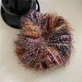 Macro shot of colorful striped plush scrunchie with soft ethnic texture and fuzzy finish - Scrunchie / Mixed Red
