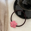 Detailed close-up of pink flower resin charm with gold lettering on elastic hair tie - Five-petal Flower Scrunchie / Pink