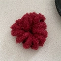 Detailed close-up of dark red fuzzy wool spiral hair tie with soft plush winter texture - Solid Brick Red