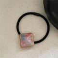 Detail of square resin charm with gold border on a high-elastic black ponytail holder - Pink Blue Mixed