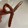 Detailed close-up of a large brown jelly hair claw clip with golden metal spring - Coffee (New Cross)