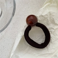 Elastic dark brown hair tie featuring a large polished spherical resin bead accent - Brown (Brown Bead)