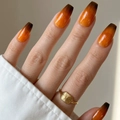 Macro shot of amber gradient press-on nails in long coffin shape with glossy finish - Cdmj-41-5