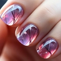 Macro detail of long press-on nails with pink gradient and delicate white floral patterns - Cdj-1-737-1ly