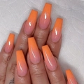 Macro view of long ballerina nails with glossy pink to orange ombre gradient finish - Cdj-7-572