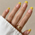 Macro detail of long coffin nails featuring bright yellow French tips and nude pink base - Cdj-4-25