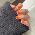 Detail showing sunset orange gradient nails with a polished round shape finish - Cdmj-29-5