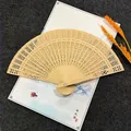 Premium 8-inch sandalwood folding fan with intricate hollow design for wedding favors - Fully Punched Style
