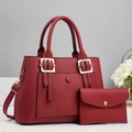 Close-up of red lychee textured leather tote bag set with golden hardware and small pouch - Bag and Pouch / Red