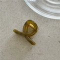 Macro view of olive green jelly resin hair claw clip with golden metal spring - Yellow & Green