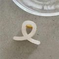 Close-up of a creamy white jelly hair claw clip with a durable gold metal spring - White