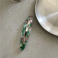 Detail view of oval acetate hair clip with green pink marble texture and silver metal base - Willow Leaf Snap Clip / Green Gradient