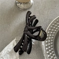 Detail of a dark brown jelly-textured resin hair claw clip with golden metal spring - Dark Coffee