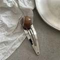 Macro view of silver metal hair clip with brown marble texture resin bead accent - Dark Coffee Marble Bead BB Clip