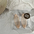 Neutral beige matte hair clips set in handmade packaging on decorative ceramic plate - Small Apricot Oval Style