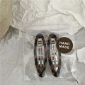 Detail of retro leopard print oval hair clips in handmade packaging with stone background - Leopard Print Oval Style