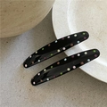 Close-up of elegant black hair clips with colorful polka dots on a stone surface - Solid Oval Style (Pair)