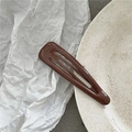 Primer plano de la horquilla BB gota de agua en metal marrón chocolate con acabado brillante - Café Oscuro