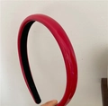 Detail shot of the glossy red PU leather headband with thick retro arched design and inner lining - True Red