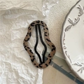 Macro shot of wavy leopard print fabric BB hair clip on a minimalist white plate - Khaki Cloud (Leopard Print)